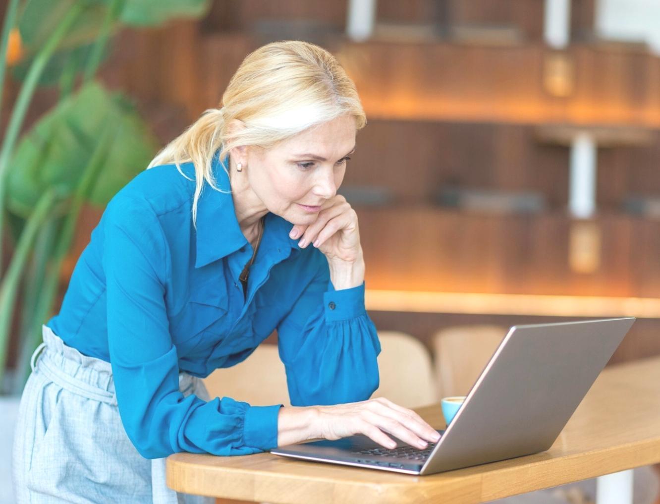 Team collaboration meeting with network diagrams and project planning materials